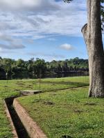 The Rainbow Bridge and Gate of Ankor Wat in the backgrouund with part of the drainage system in the foreground