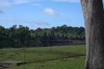 The Rainbow Bridge and Gate of Ankor Wat in the backgrouund with part of the drainage system in the foreground